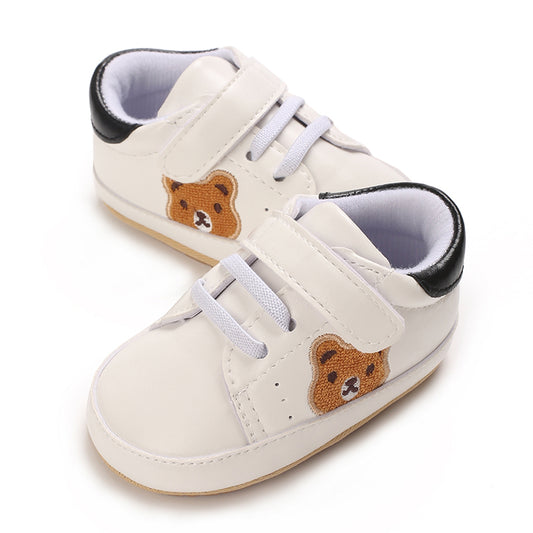 Lära gå skor, bebisskor, babyskor med björnmotiv, svart vit, från sidan